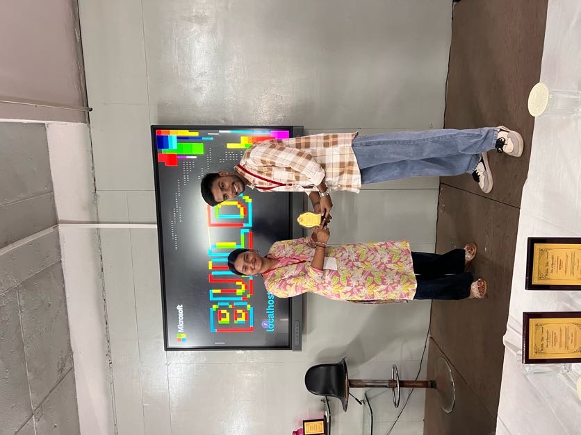 A proud moment — top performers receiving their award in front of the Microsoft BUILD display.